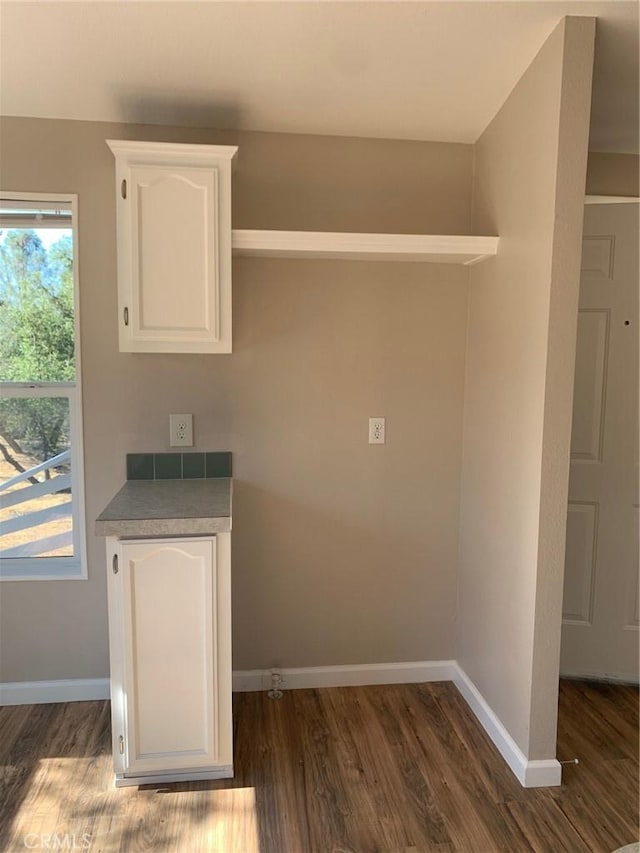 laundry area featuring dark hardwood / wood-style flooring