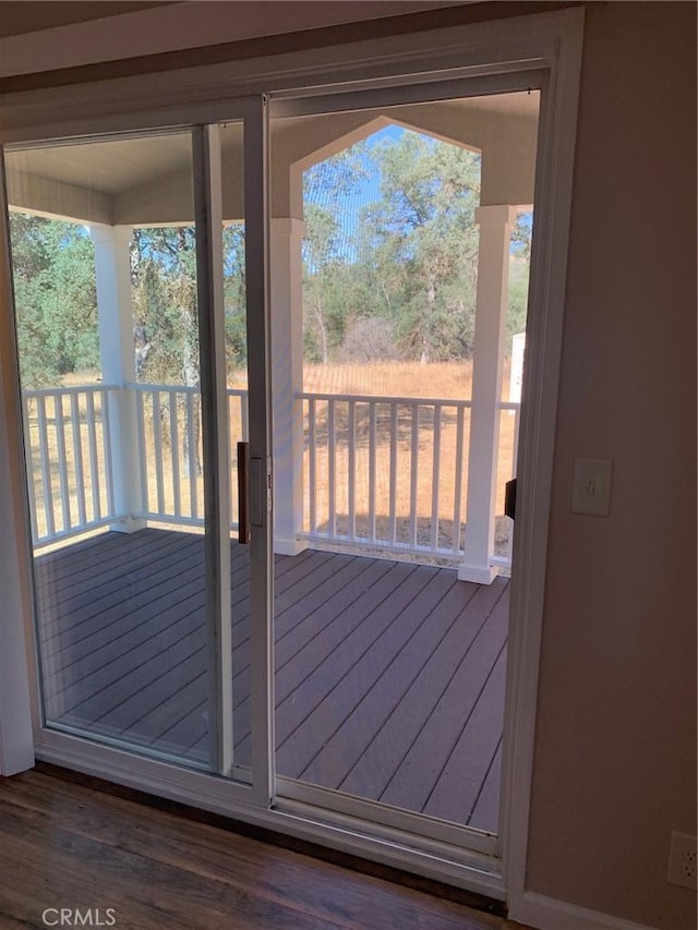 entryway featuring hardwood / wood-style floors and a healthy amount of sunlight