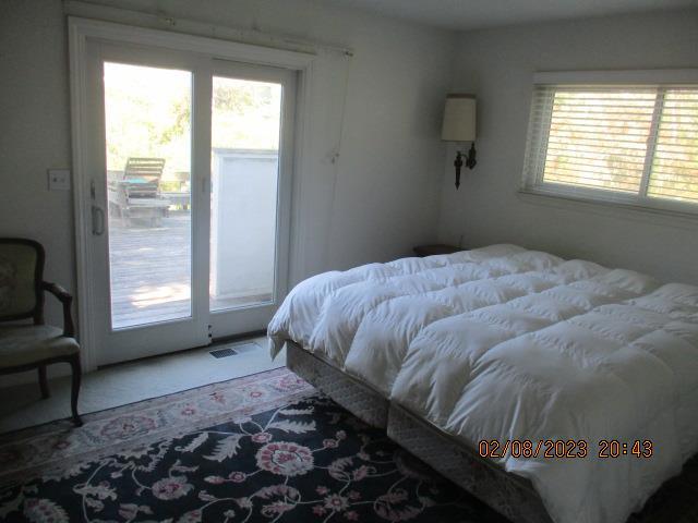 bedroom featuring access to outside