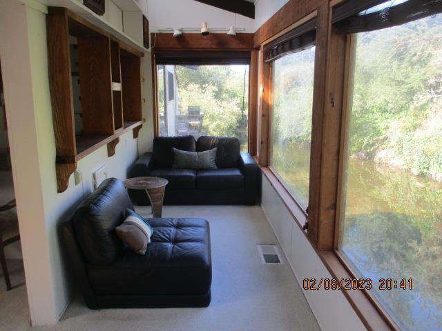 sunroom / solarium with plenty of natural light and lofted ceiling