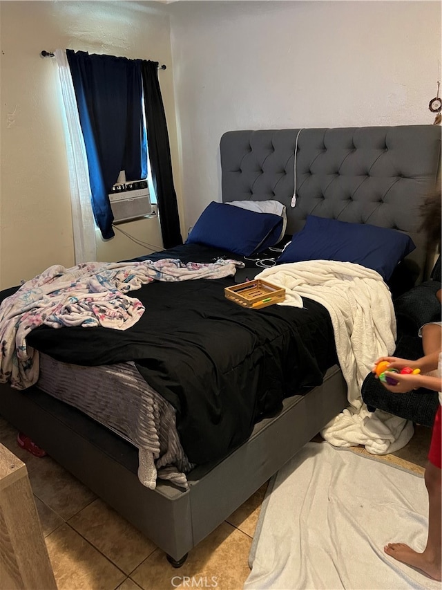 bedroom featuring light tile flooring