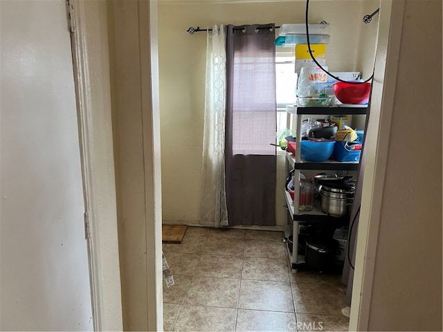 interior space featuring light tile floors