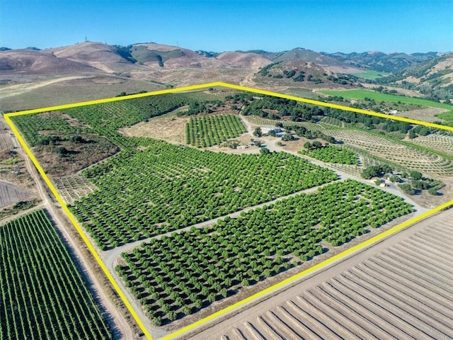 aerial view featuring a rural view and a mountain view