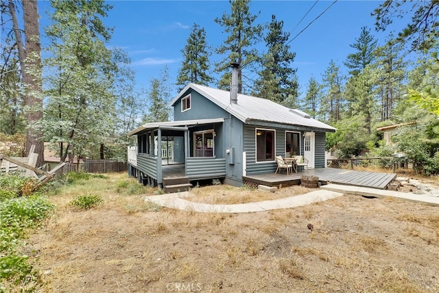 bungalow-style house featuring a deck