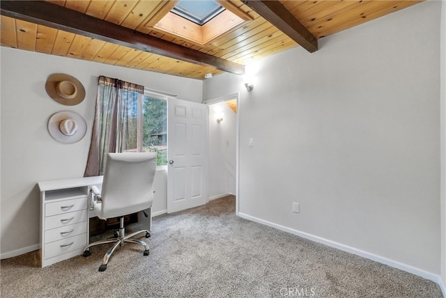 unfurnished office with light carpet, wooden ceiling, a skylight, and beamed ceiling