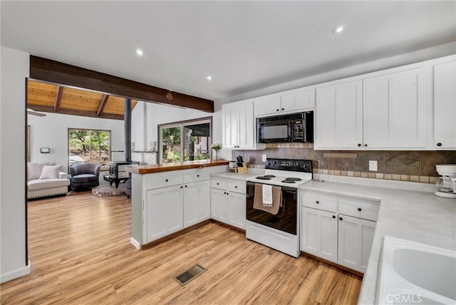 kitchen with kitchen peninsula, white electric range oven, light hardwood / wood-style flooring, white cabinets, and lofted ceiling with beams