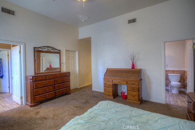 bedroom featuring carpet flooring and ensuite bathroom