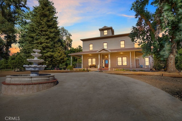 view of front of property featuring covered porch