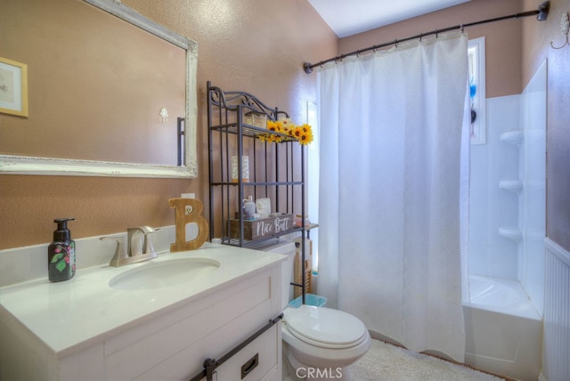 full bathroom with shower / bath combination with curtain, toilet, and vanity