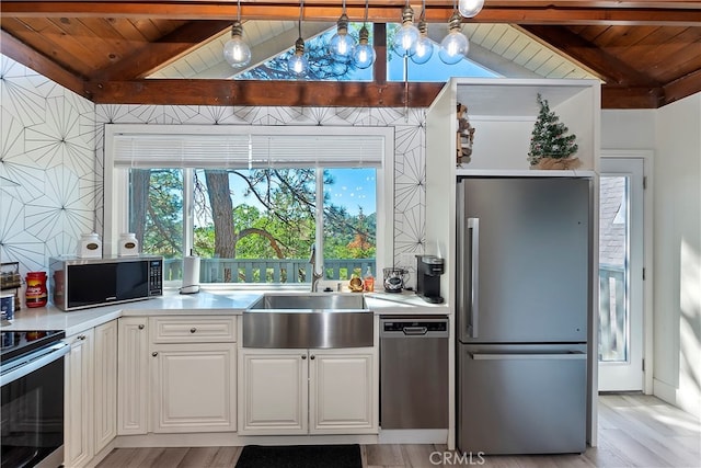 kitchen featuring white cabinets, light hardwood / wood-style floors, wood ceiling, and appliances with stainless steel finishes