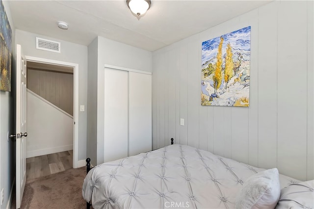 bedroom with carpet floors and a closet