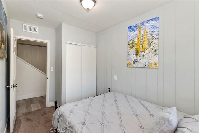 bedroom with carpet floors and a closet