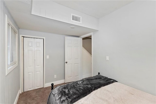 bedroom with carpet and a closet