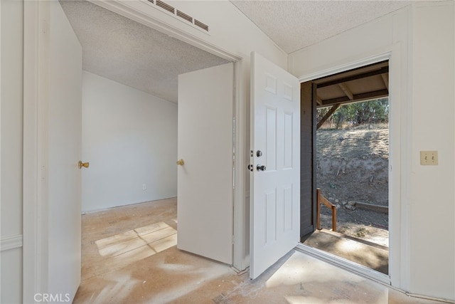 foyer featuring a textured ceiling