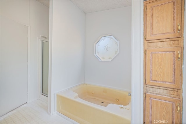 bathroom featuring shower with separate bathtub