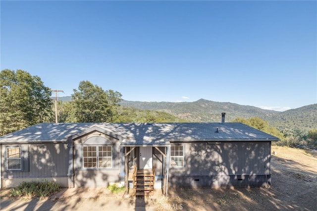 ranch-style home featuring a mountain view