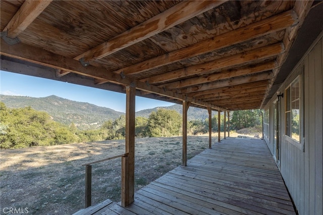 view of dock with a deck with mountain view