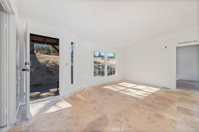 empty room featuring a textured ceiling