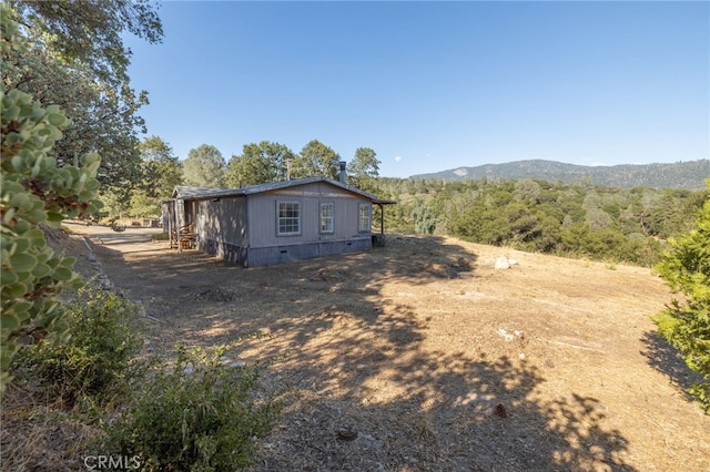 exterior space featuring a mountain view