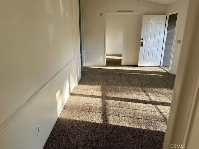 hallway featuring carpet