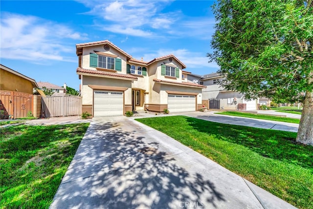 view of front of home with a front yard and a garage