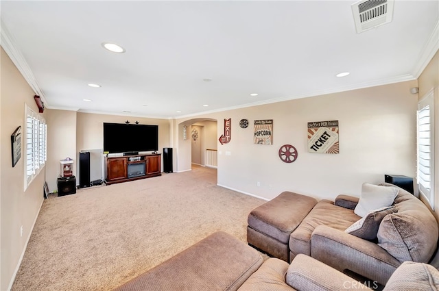 carpeted living room with ornamental molding