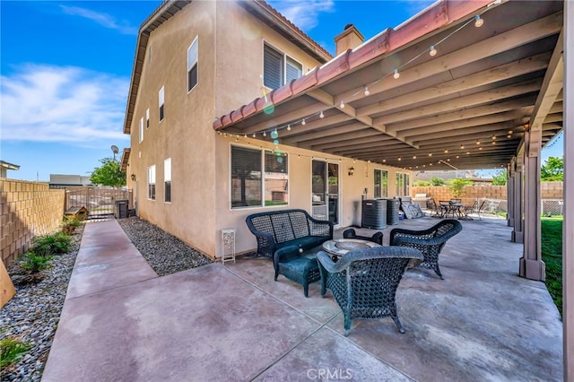 view of patio with outdoor lounge area and central air condition unit