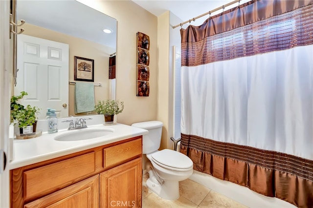 bathroom featuring tile floors, toilet, and vanity