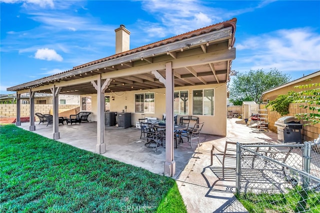 view of patio with a grill and central AC unit