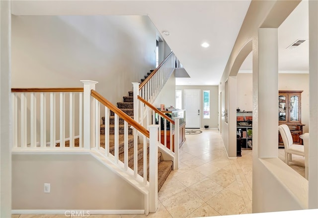 stairs with light tile floors