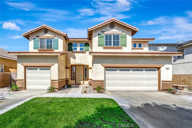 view of front of house with a front yard and a garage