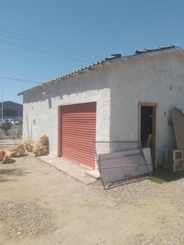 view of property exterior with a garage