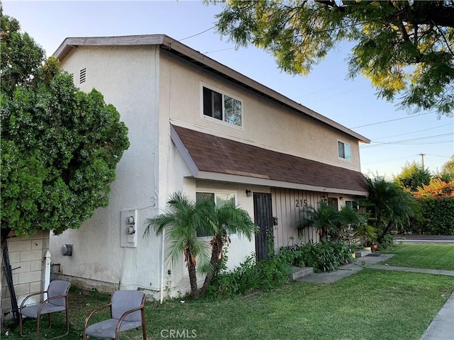 view of home's exterior with a yard