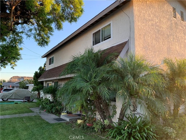 view of home's exterior featuring a lawn