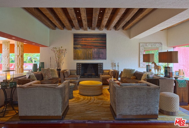 living room featuring hardwood / wood-style floors and beam ceiling