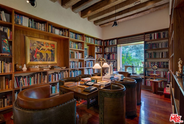 office featuring beamed ceiling and dark hardwood / wood-style flooring