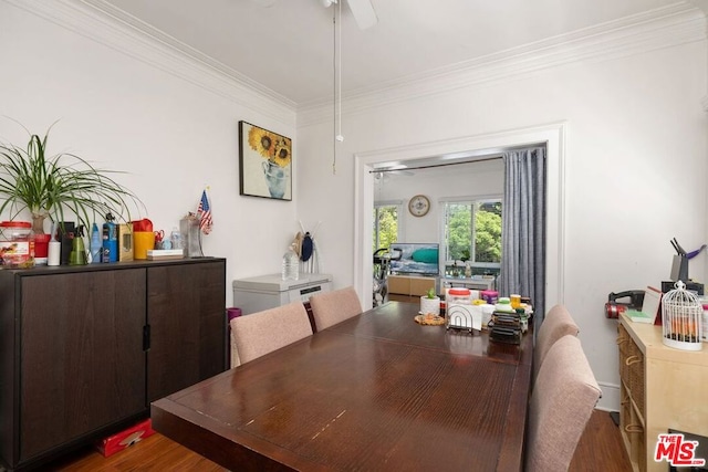 dining area featuring ornamental molding, ceiling fan, and dark hardwood / wood-style flooring