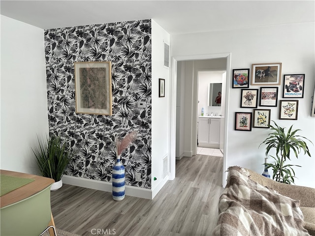 interior space with light hardwood / wood-style flooring and sink