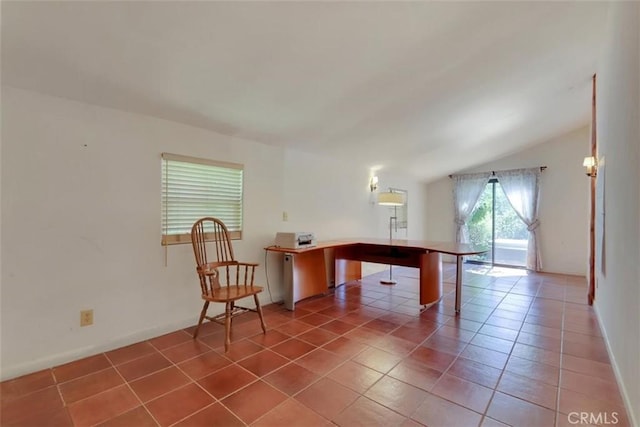 tiled office with baseboards and lofted ceiling