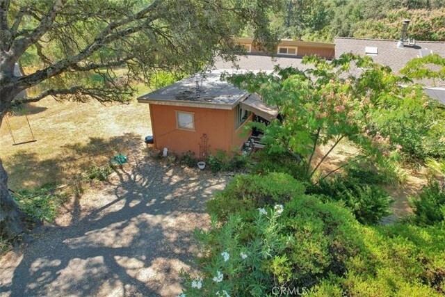view of property exterior featuring an outdoor structure