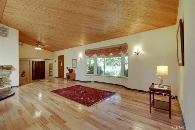 living room featuring ceiling fan, wood ceiling, a fireplace, light wood-type flooring, and vaulted ceiling