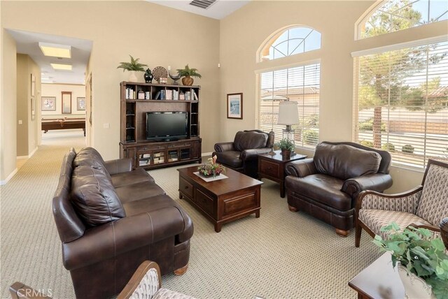 carpeted living room featuring a wealth of natural light and pool table