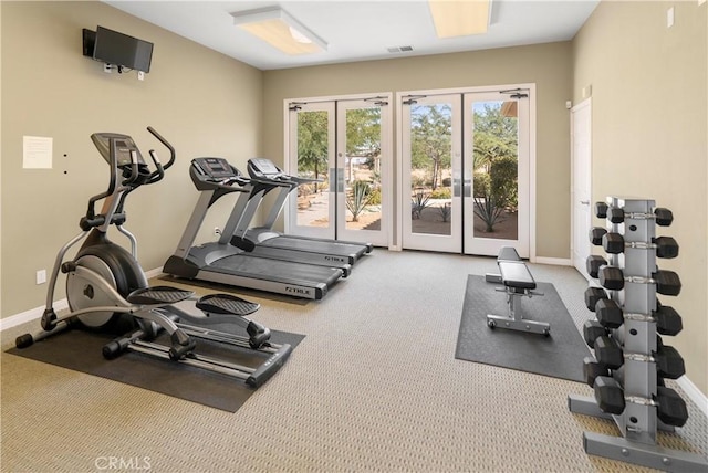 exercise room featuring carpet and french doors