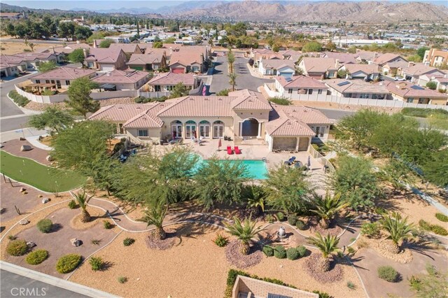 birds eye view of property featuring a mountain view