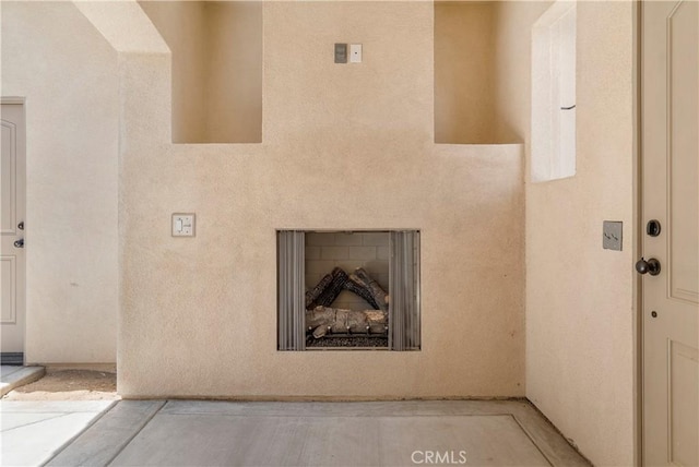 entrance to property with a fireplace