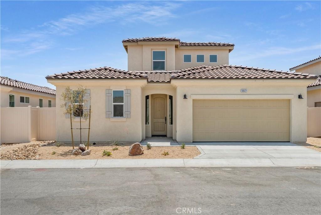 mediterranean / spanish-style house featuring a garage