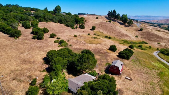 birds eye view of property featuring a rural view