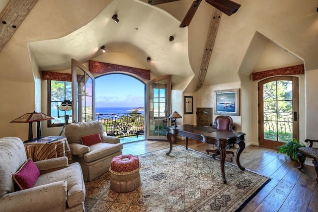 home office featuring hardwood / wood-style floors, high vaulted ceiling, and beam ceiling