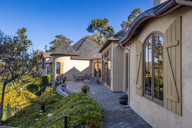 view of home's exterior with a patio