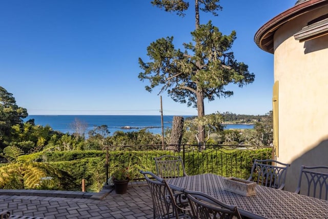 view of patio featuring a water view